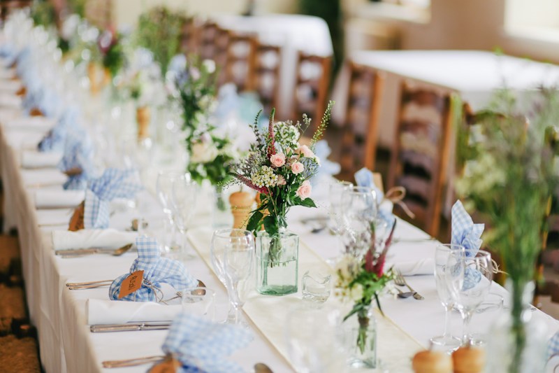 A candlelit reception table ready for friends and family